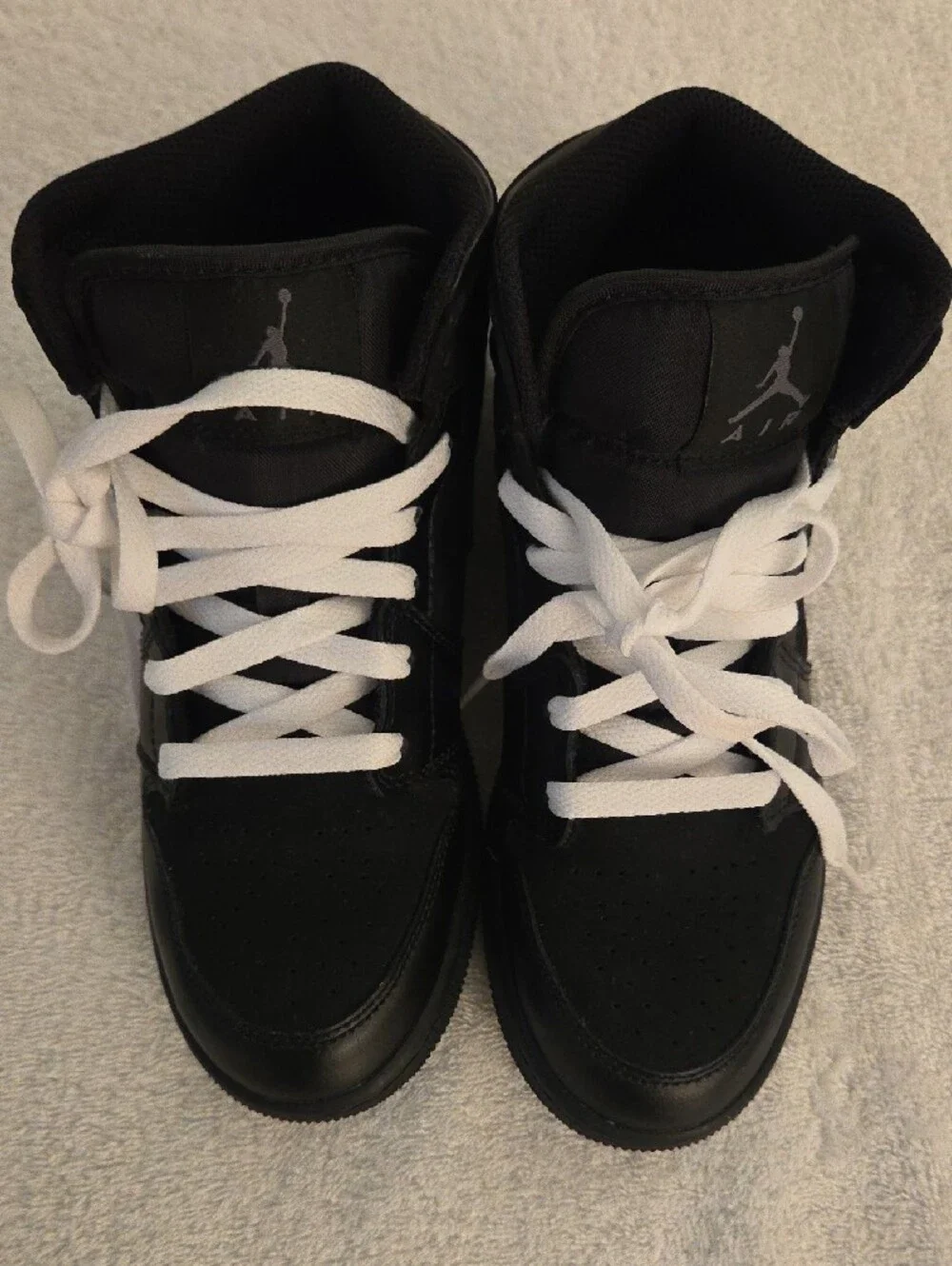 Jordan Kids Black and White High-Top Sneakers